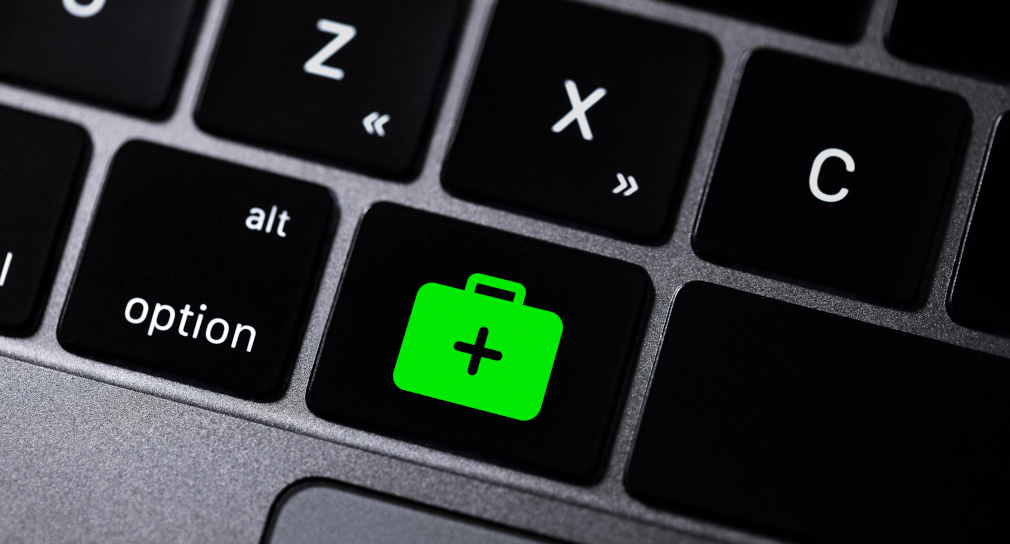 Link zur Seite Informationsquellen, (Foto: Tastatur mit Erste-Hilfe-Symbol)